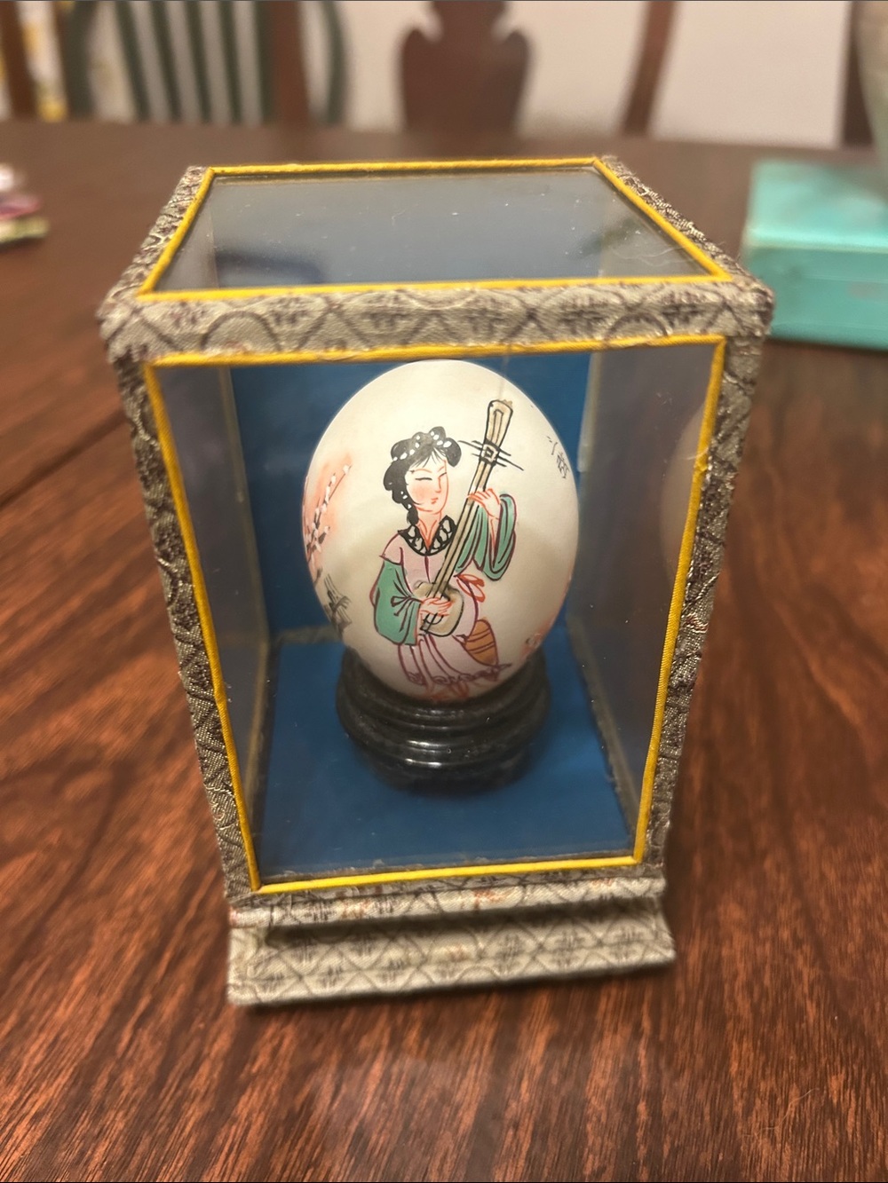 Vintage Asian hand painted egg in glass case
